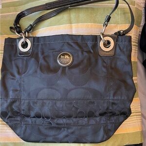 Very nice Black Tote leather Coach bag. Almost new.